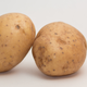 two potatoes leaning on each other